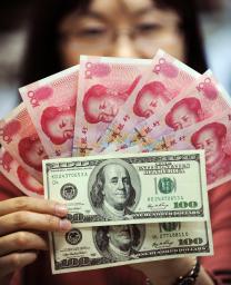 人民元の変動幅を拡大 17日から上下2%に